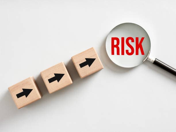 Professional reviewing documents with magnifying glass